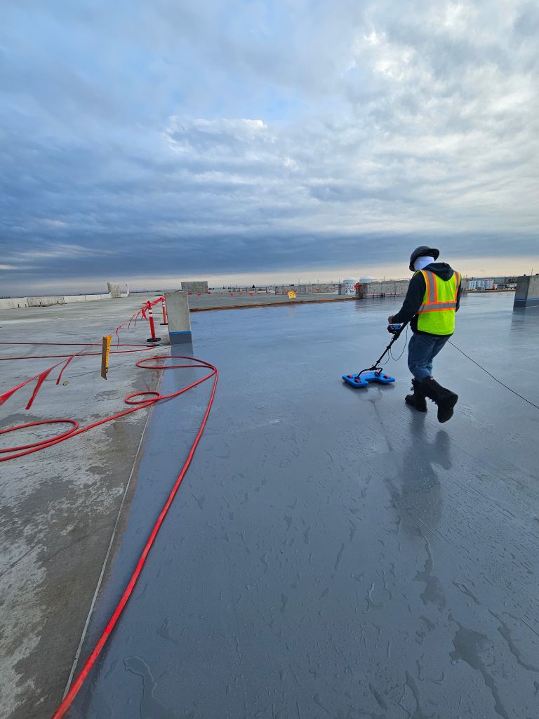 ELD Solutions technician using IntegriScan electronic leak detection equipment on rooftop