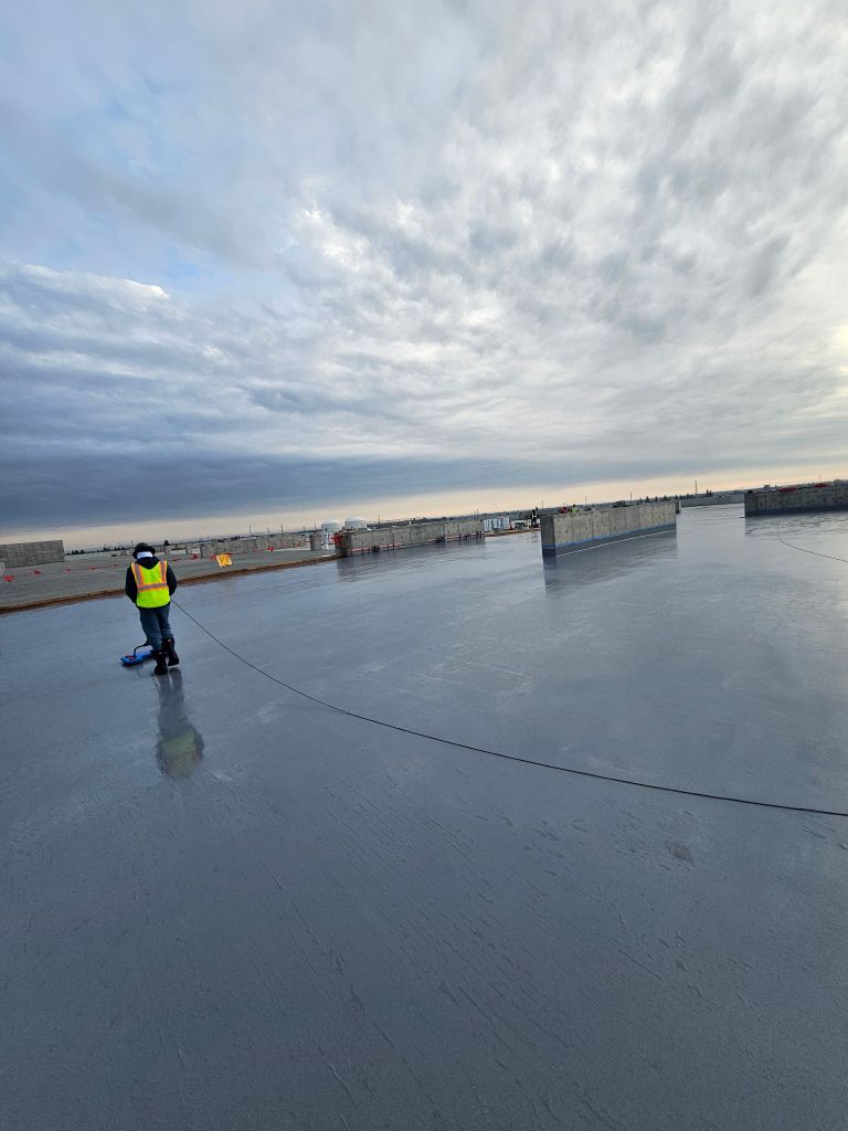 Wide rooftop view during electronic leak detection inspection